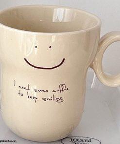 Ceramic Cup "I Need Some Coffee to Keep Smiling" – a product designed for coffee enthusiasts. A perfect gift for everyone.