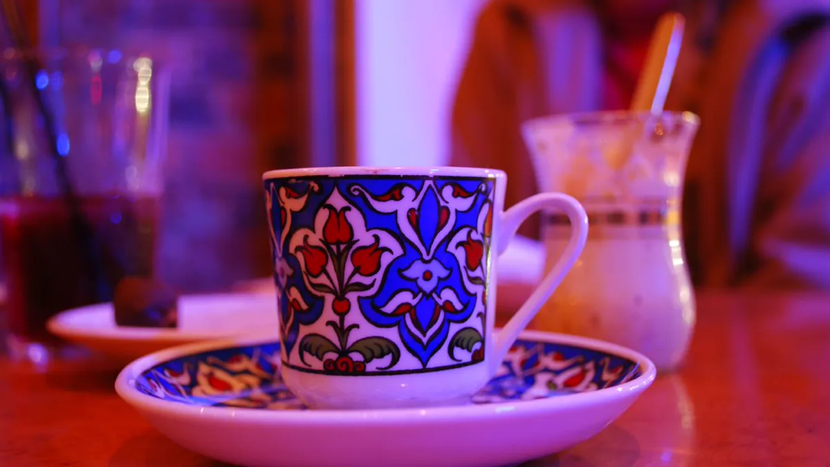 A freshly brewed cup of black coffee on a rustic wooden table