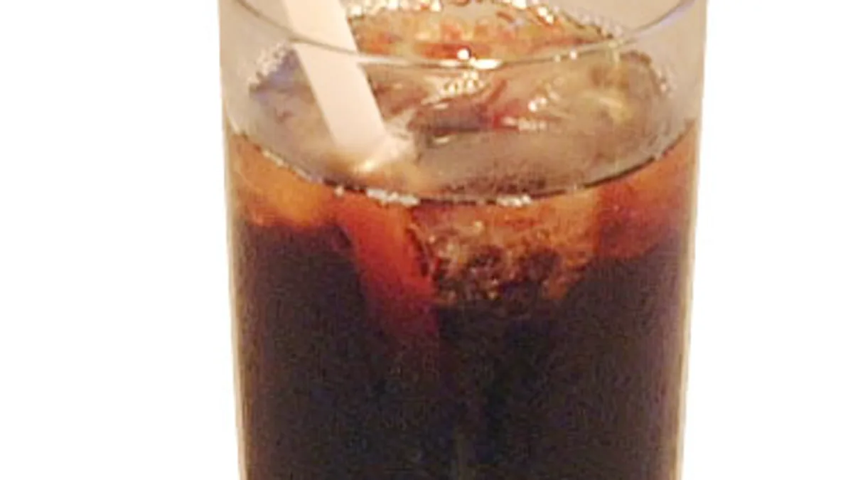 Glass carafe filled with filtered cold brew coffee concentrate