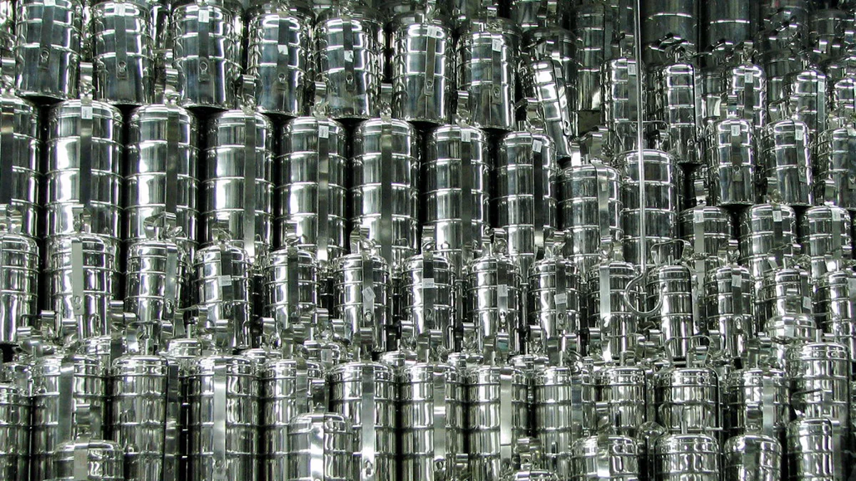 Close up of precision-machined stainless steel conical burr teeth showing clean cutting edges free of rancid oils